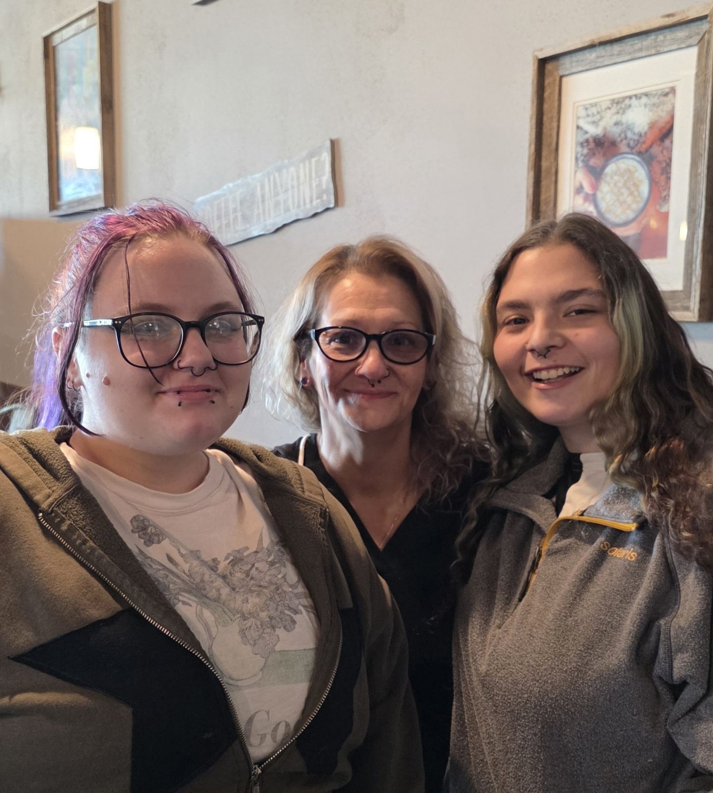 Sandra with their daughters in a family portrait