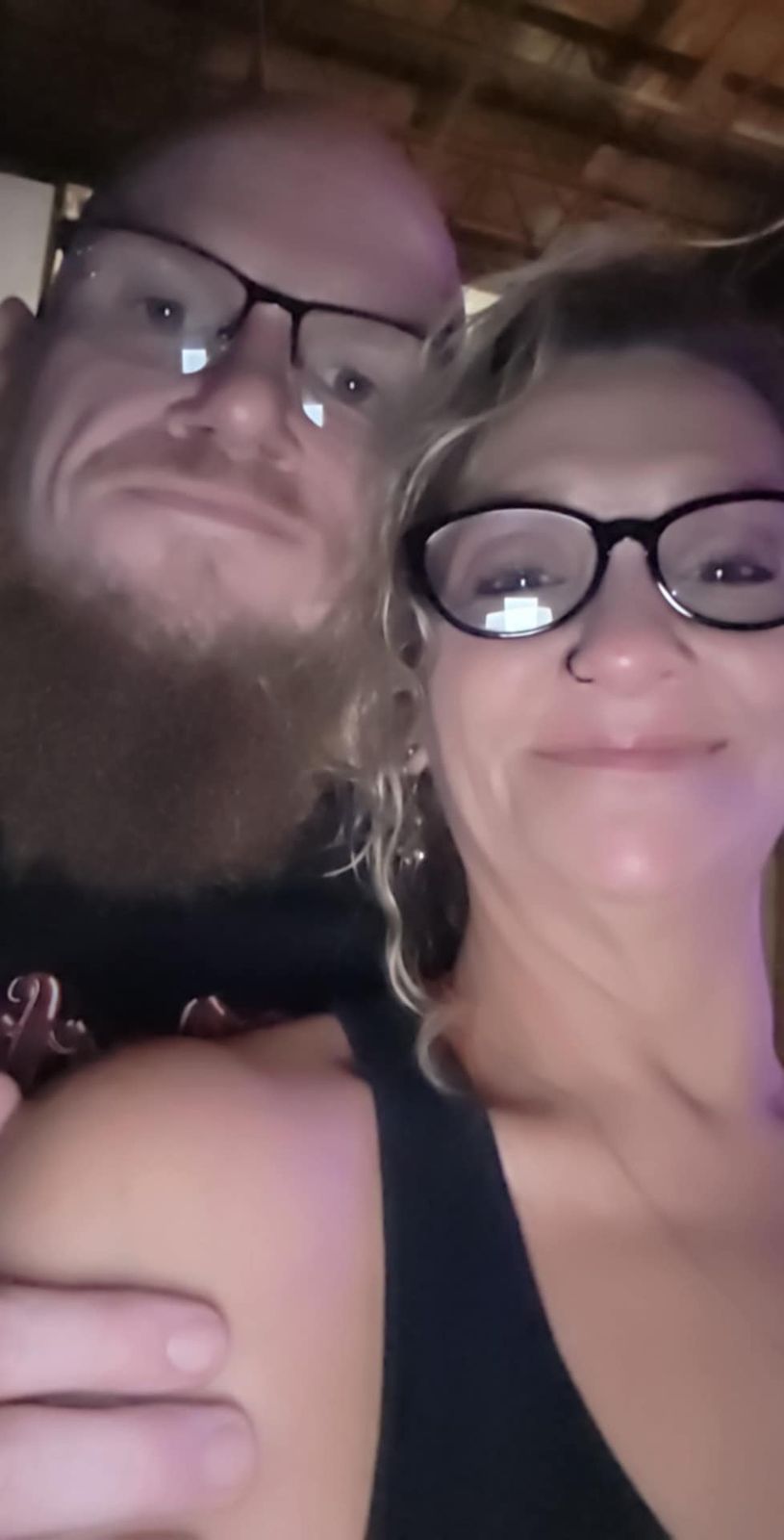 Tank and Sandra smiling together in a close portrait