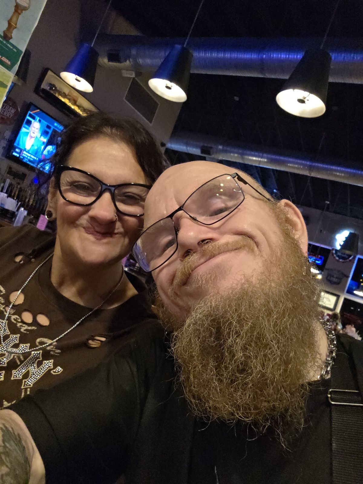 Tank and Sandra leaning together and smiling